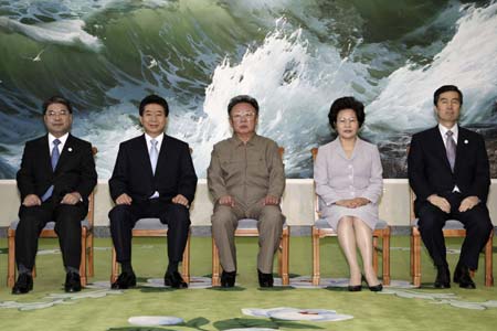  South Korean President Roh Moo-hyun (2nd L), the top leader of the Democratic People's Republic of Korea (DPRK) Kim Jong Il (3rd L) and Roh's wife Kwon Yang-sook (2nd R) pose for pictures before the inter-Korean summit in Pyongyang, capital of DPRK, Oct. 3, 2007. The leaders of the two sides started their summit meeting Wednesday morning on inter-Korean co-prosperity, peace, reconciliation and reunification. 