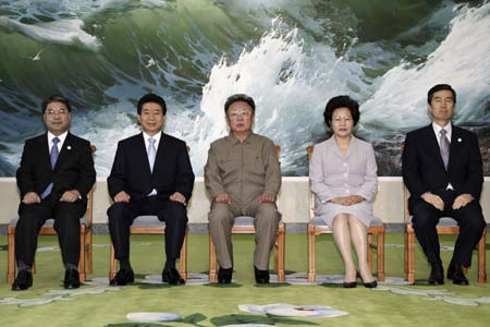 South Korean President Roh Moo-hyun (2nd L), the top leader of the Democratic People's Republic of Korea (DPRK) Kim Jong Il (3rd L) and Roh's wife Kwon Yang-sook (2nd R) pose for pictures before the inter-Korean summit in Pyongyang, capital of DPRK, Oct. 3, 2007. The leaders of the two sides started their summit meeting Wednesday morning on inter-Korean co-prosperity, peace, reconciliation and reunification.