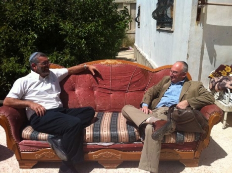 Knesset members Michael Ben-Ari (left) and Aryeh Eldad on the evicted Natcheh family's sofa in Beit Hanina. (Photo: Michael Ben-Ari)