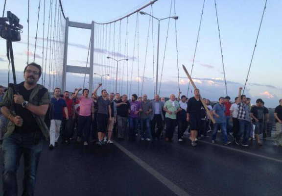 Activists march across the Bosphorus bridge and head to Taksim Square 