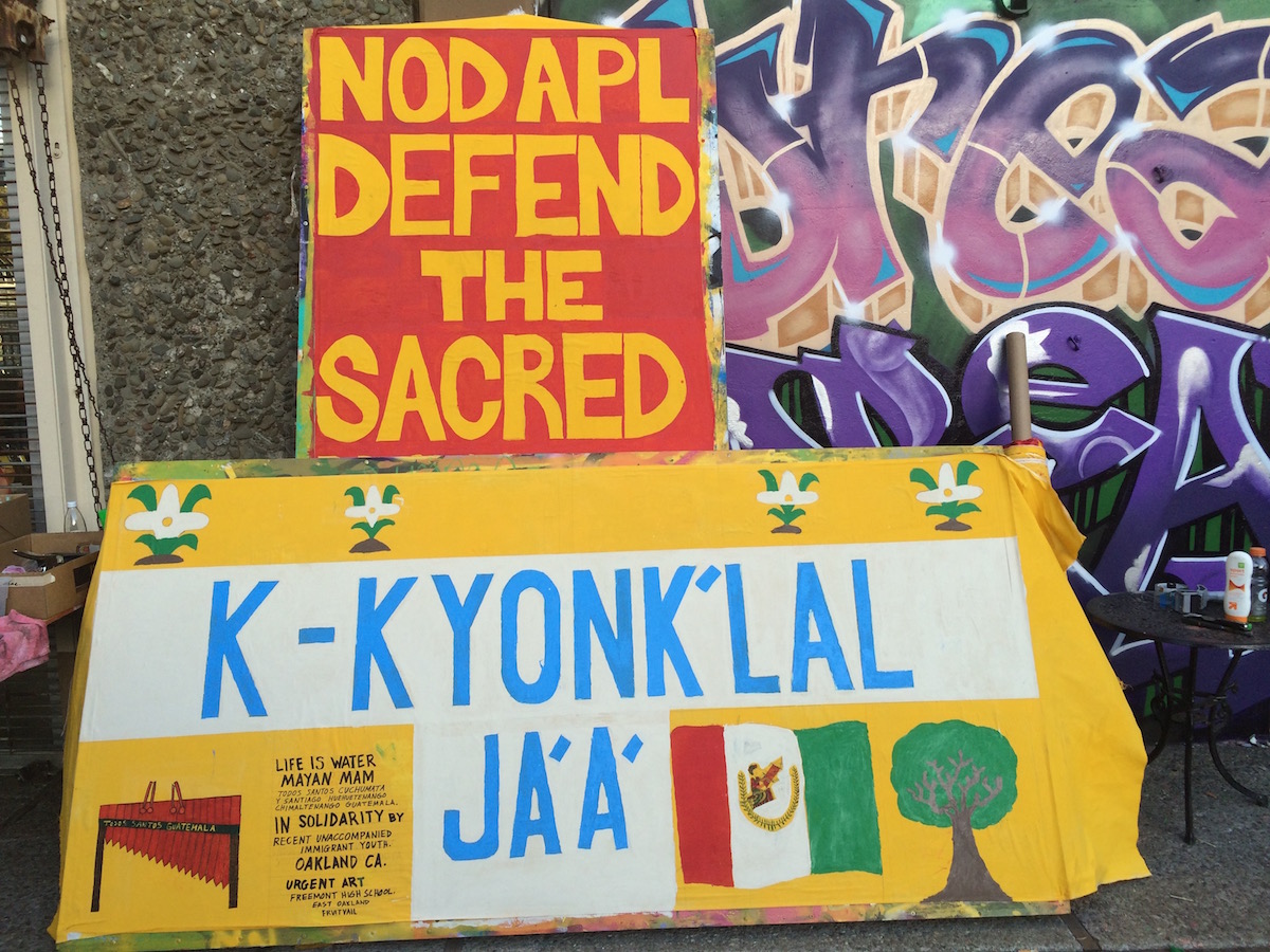 Art build in Oakland, CA : Recent unaccompanied minors from Guatemala write Water is Life in Maya. (Photo: Nadya Tannous)